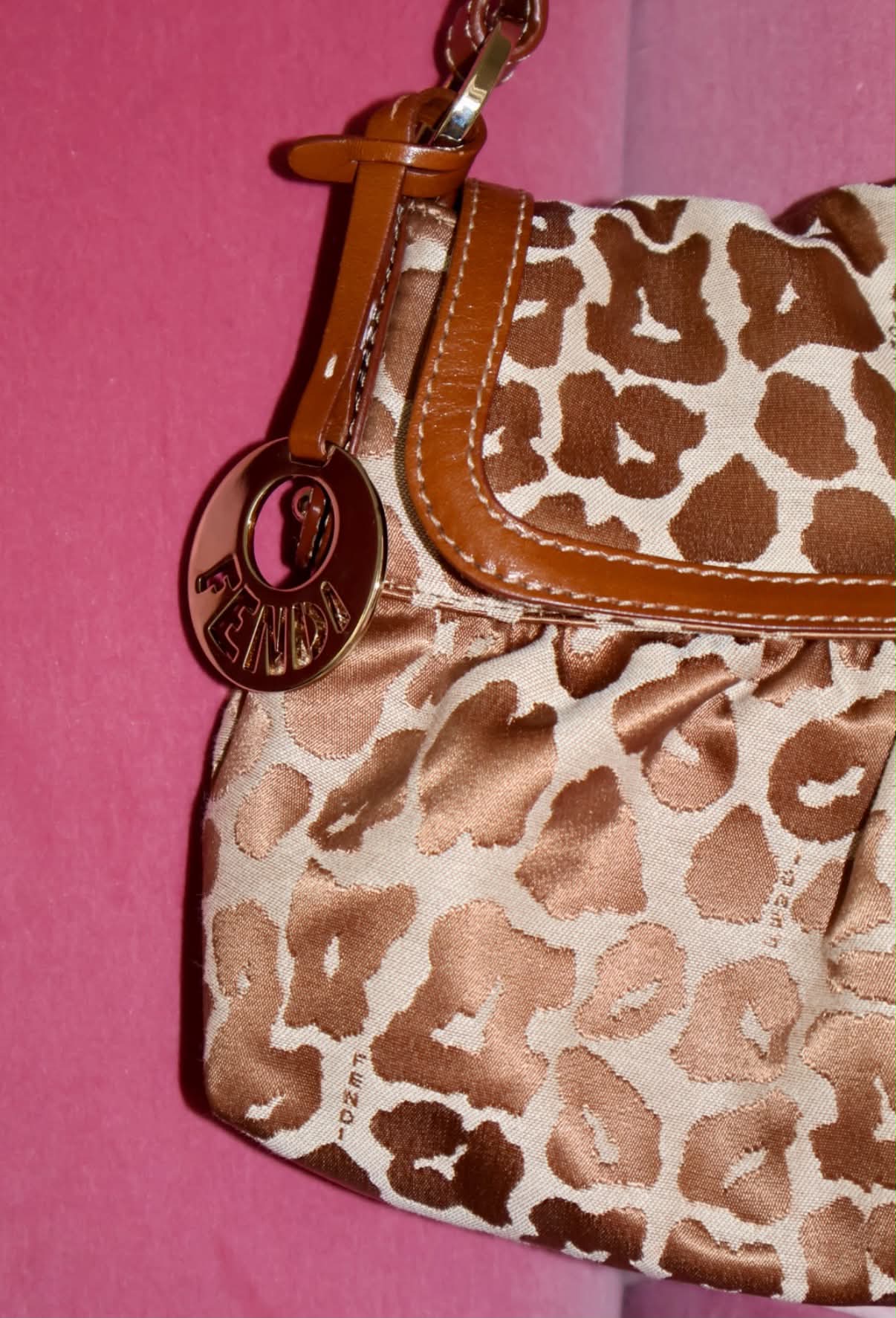 Fendi leopard print satin baguette bag with tan leather trim and gold logo charm